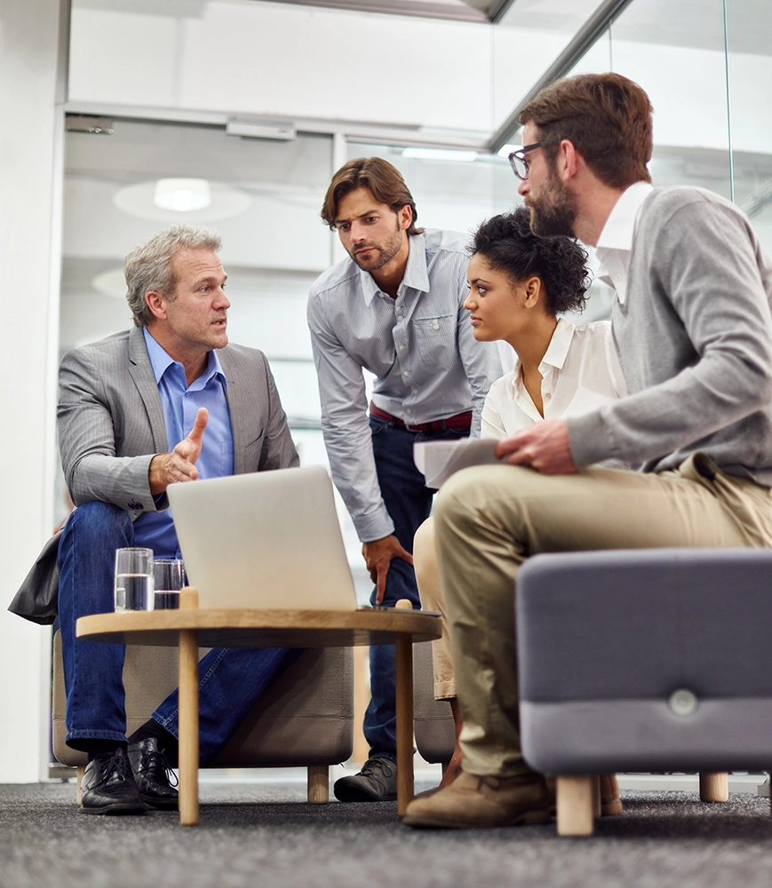 Team members meeting with a consultant to discuss collaboration and opportunities